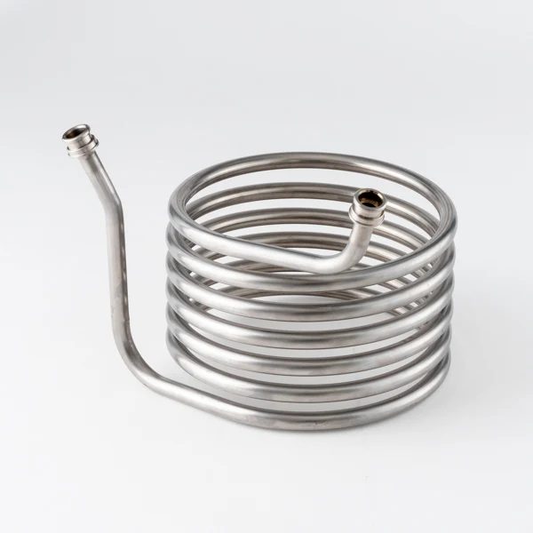Helical tube coil with two raised ends and connection fittings