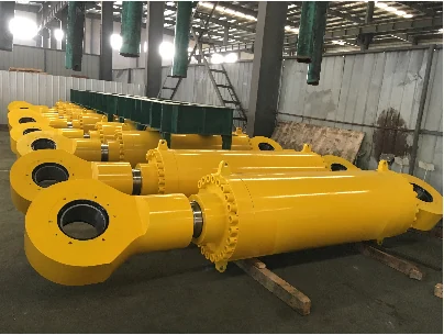 Yellow hydraulic cylinder assemblies arranged in a workshop